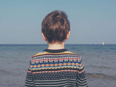 boy looking out towards water